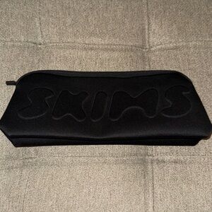 SKIMS large neoprene pouch